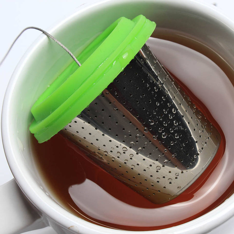 Large capacity basket tea infuser with etched fine fine holes and long wire handle and stainless steel drip tray