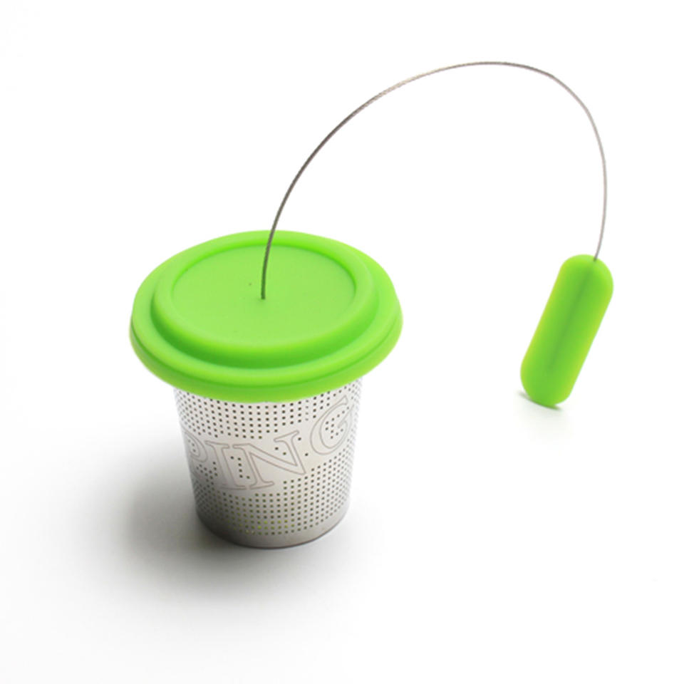 Large capacity basket tea infuser with etched fine fine holes and long wire handle and stainless steel drip tray