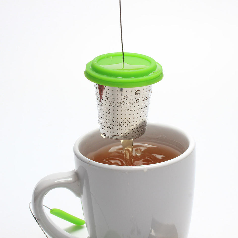 Large capacity basket tea infuser with etched fine fine holes and long wire handle and stainless steel drip tray